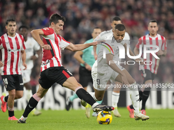 Kylian Mbappe centre-forward of Real Madrid and France and Dani Vivian centre-back of Athletic Club and Spain compete for the ball during th...