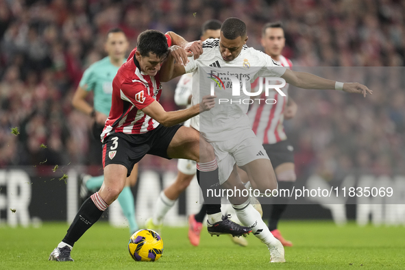 Kylian Mbappe centre-forward of Real Madrid and France and Dani Vivian centre-back of Athletic Club and Spain compete for the ball during th...