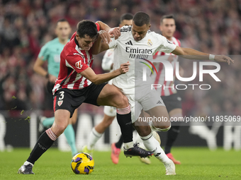 Kylian Mbappe centre-forward of Real Madrid and France and Dani Vivian centre-back of Athletic Club and Spain compete for the ball during th...