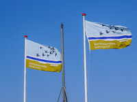 Flags of Wadden Sea National Park are seen in Nordby, Fano Island, Denmark, on April 29, 2024. (