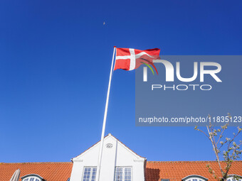 The Danish flag is seen in the wind in Nordby, Fano Island, Denmark, on April 29, 2024. (