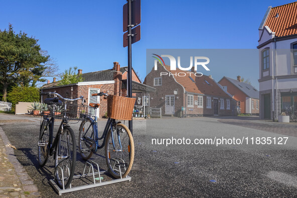 A general view of the traditional Danish houses with bicycles parked in the foreground is seen in Nordby, Fano Island, Denmark, on April 29,...