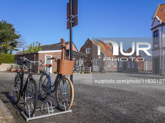 A general view of the traditional Danish houses with bicycles parked in the foreground is seen in Nordby, Fano Island, Denmark, on April 29,...