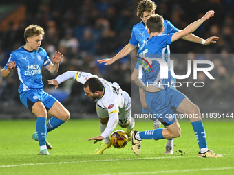 Mason Bennett (32 Burton Albion) is challenged by Oscar Wallin (5 Peterborough United) during the Sky Bet League 1 match between Peterboroug...