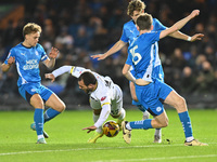 Mason Bennett (32 Burton Albion) is challenged by Oscar Wallin (5 Peterborough United) during the Sky Bet League 1 match between Peterboroug...