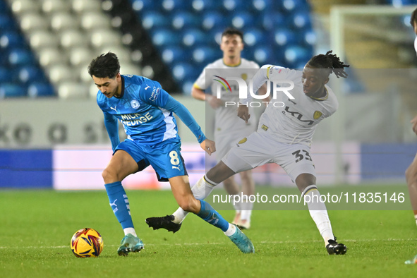 Ryan De Havilland (8, Peterborough United) is challenged by Kgaogelo Chauke (33, Burton Albion) during the Sky Bet League 1 match between Pe...