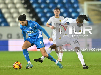 Ryan De Havilland (8, Peterborough United) is challenged by Kgaogelo Chauke (33, Burton Albion) during the Sky Bet League 1 match between Pe...