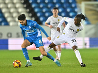 Ryan De Havilland (8, Peterborough United) is challenged by Kgaogelo Chauke (33, Burton Albion) during the Sky Bet League 1 match between Pe...