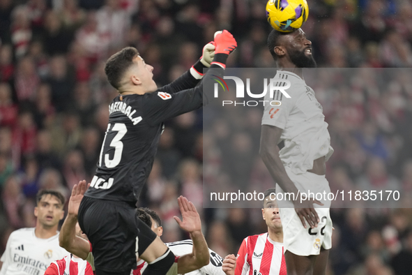 Antonio Rudiger centre-back of Real Madrid and Germany and Julen Agirrezabala goalkeeper of Athletic Club and Spain compete for the ball dur...