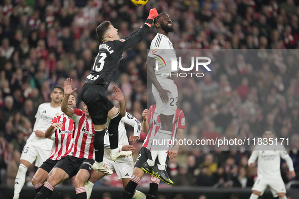 Antonio Rudiger centre-back of Real Madrid and Germany and Julen Agirrezabala goalkeeper of Athletic Club and Spain compete for the ball dur...