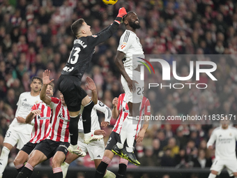 Antonio Rudiger centre-back of Real Madrid and Germany and Julen Agirrezabala goalkeeper of Athletic Club and Spain compete for the ball dur...