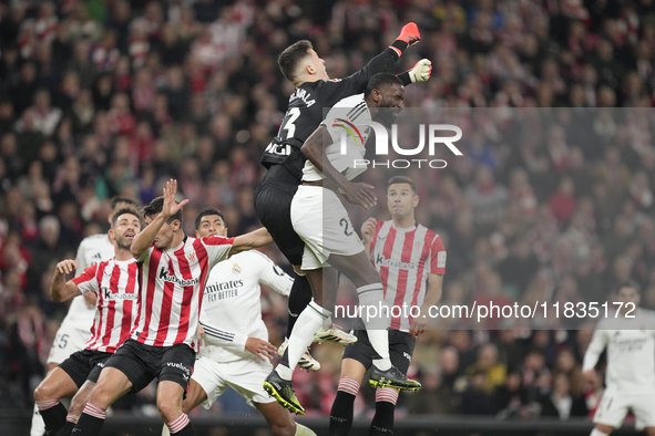 Antonio Rudiger centre-back of Real Madrid and Germany and Julen Agirrezabala goalkeeper of Athletic Club and Spain compete for the ball dur...