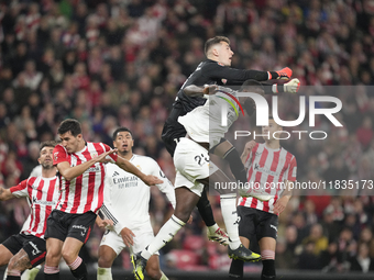 Antonio Rudiger centre-back of Real Madrid and Germany and Julen Agirrezabala goalkeeper of Athletic Club and Spain compete for the ball dur...