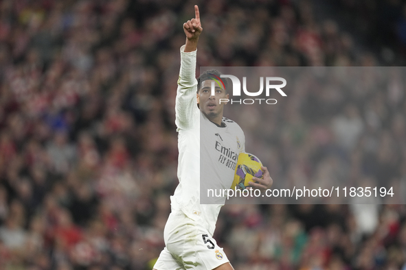 Jude Bellingham central midfield of Real Madrid and England celebrates after scoring his sides first goal during the La Liga match between A...