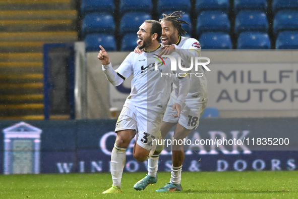 Mason Bennett (32 Burton Albion) celebrates after scoring the team's first goal with Rumarn Burrell (18 Burton Albion) during the Sky Bet Le...