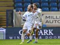 Mason Bennett (32 Burton Albion) celebrates after scoring the team's first goal with Rumarn Burrell (18 Burton Albion) during the Sky Bet Le...