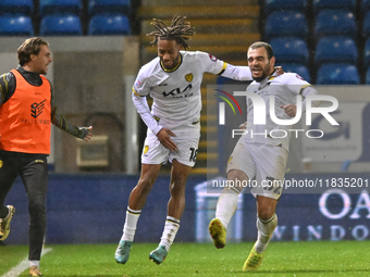 Mason Bennett (32 Burton Albion) celebrates after scoring the team's first goal with Rumarn Burrell (18 Burton Albion) during the Sky Bet Le...