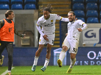 Mason Bennett (32 Burton Albion) celebrates after scoring the team's first goal with Rumarn Burrell (18 Burton Albion) during the Sky Bet Le...