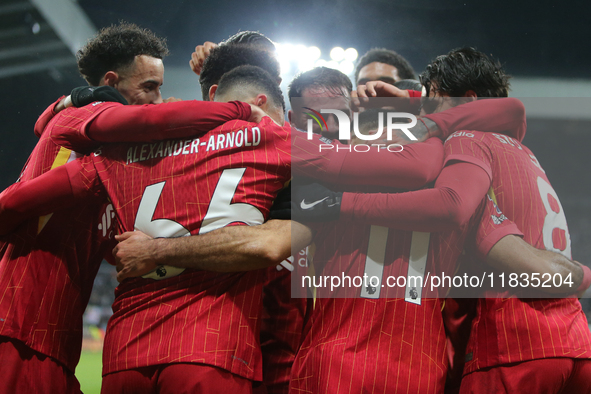 Liverpool's players celebrate Mohamed Salah's goal during the Premier League match between Newcastle United and Liverpool at St. James's Par...