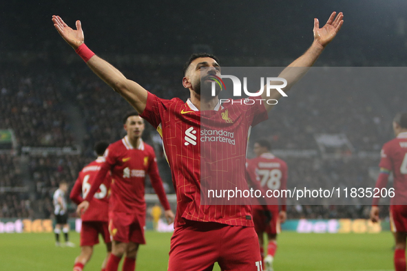 Liverpool's Mohamed Salah celebrates his second goal during the Premier League match between Newcastle United and Liverpool at St. James's P...