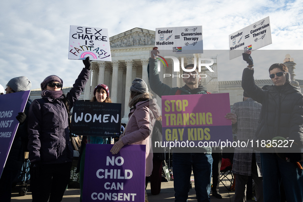 People demonstrations outside the Supreme Court against gender-affirming care for transgender children in Washington, DC, on December 4, 202...