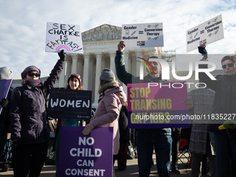 People demonstrations outside the Supreme Court against gender-affirming care for transgender children in Washington, DC, on December 4, 202...