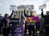 People demonstrations outside the Supreme Court against gender-affirming care for transgender children in Washington, DC, on December 4, 202...