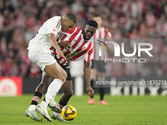 Kylian Mbappe centre-forward of Real Madrid and France and Inaki Williams right winger of Athletic Club and Ghana compete for the ball durin...