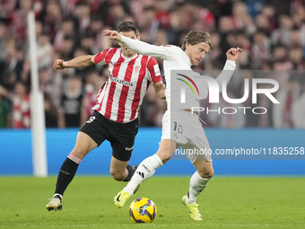 Luka Modric central midfield of Real Madrid and Croatia and Inigo Ruiz de Galarreta central midfield of Athletic Club and Spain compete for...