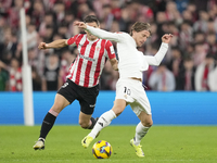 Luka Modric central midfield of Real Madrid and Croatia and Inigo Ruiz de Galarreta central midfield of Athletic Club and Spain compete for...