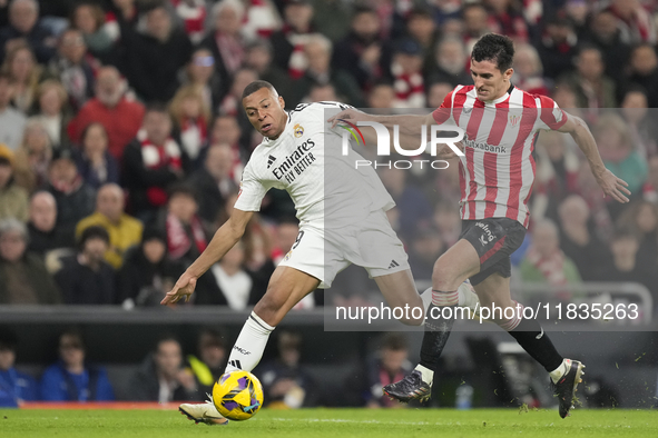 Kylian Mbappe centre-forward of Real Madrid and France and Dani Vivian centre-back of Athletic Club and Spain compete for the ball during th...