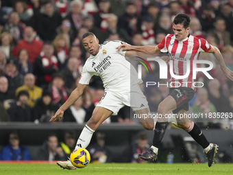 Kylian Mbappe centre-forward of Real Madrid and France and Dani Vivian centre-back of Athletic Club and Spain compete for the ball during th...