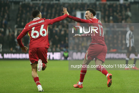 Trent Alexander-Arnold and Curtis Jones celebrate Liverpool's second goal during the Premier League match between Newcastle United and Liver...