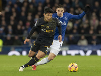 Hwang Hee-chan #11 of Wolverhampton Wanderers F.C. is tackled by Vitaliy Mykolenko #19 of Everton F.C. during the Premier League match betwe...