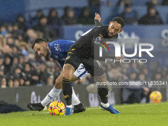 Dwight McNeil #7 of Everton F.C. takes on Matheus Cunha #10 of Wolverhampton Wanderers F.C. during the Premier League match between Everton...