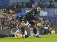 Dwight McNeil #7 of Everton F.C. takes on Matheus Cunha #10 of Wolverhampton Wanderers F.C. during the Premier League match between Everton...