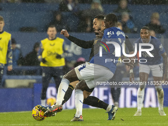 Abdoulaye Doucoure #16 of Everton F.C. tackles the opponent during the Premier League match between Everton and Wolverhampton Wanderers at G...