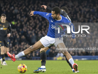 Iliman Ndiaye #10 of Everton F.C. is tackled by the opponent during the Premier League match between Everton and Wolverhampton Wanderers at...