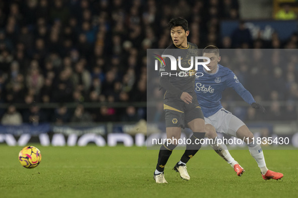 Vitaliy Mykolenko #19 of Everton F.C. challenges the opponent during the Premier League match between Everton and Wolverhampton Wanderers at...