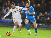 Mason Bennett (32 Burton Albion) is challenged by Oscar Wallin (5 Peterborough United) during the Sky Bet League 1 match between Peterboroug...