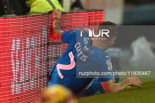 Sam Curtis (2 Peterborough United) crashes into advertising boards during the Sky Bet League 1 match between Peterborough United and Burton...