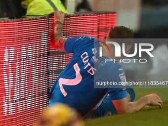 Sam Curtis (2 Peterborough United) crashes into advertising boards during the Sky Bet League 1 match between Peterborough United and Burton...