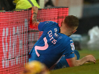 Sam Curtis (2 Peterborough United) crashes into advertising boards during the Sky Bet League 1 match between Peterborough United and Burton...