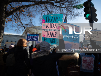 Demonstrators support gender-affirming care for transgender children outside the Supreme Court in Washington, DC, on December 4, 2024.  The...