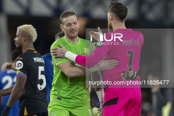 Jordan Pickford #1 (GK) of Everton F.C. and Jose Sa #1 (GK) of Wolverhampton Wanderers F.C. are at full time during the Premier League match...