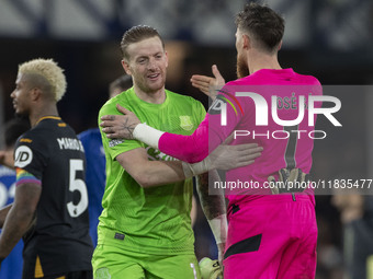 Jordan Pickford #1 (GK) of Everton F.C. and Jose Sa #1 (GK) of Wolverhampton Wanderers F.C. are at full time during the Premier League match...