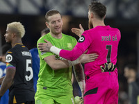 Jordan Pickford #1 (GK) of Everton F.C. and Jose Sa #1 (GK) of Wolverhampton Wanderers F.C. are at full time during the Premier League match...