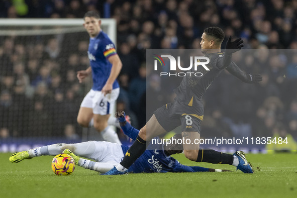 Joao Gomes #8 of Wolverhampton Wanderers F.C. stretches for the ball during the Premier League match between Everton and Wolverhampton Wande...