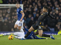 Joao Gomes #8 of Wolverhampton Wanderers F.C. stretches for the ball during the Premier League match between Everton and Wolverhampton Wande...