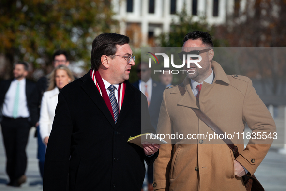 Tennessee Attorney General Jonathan Skrmetti talks with an aide following oral arguments at the Supreme Court on his state's ban on gender-a...